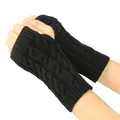 Detailed view of black cable-knit fingerless gloves with elegant winter patterns - One Size / Black