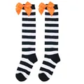 Close-up of black and white striped children's knee-high socks with orange bows - Kids (7-12 Years) / Black White Wide Striped/Orange Bow