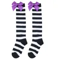 Detailed view of girls black and white striped over-the-knee socks with purple satin bows. - Kids (7-12 Years) / Black White Wide Striped/Purple Bow