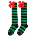 Close-up detail of green and black striped Christmas over-the-knee socks with red bows. - Kids (7-12 Years) / Green and Black Stripes with Red Bow