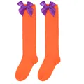 Detail of orange over-the-knee socks for girls featuring decorative purple bows - Kids (7-12 Years) / Solid Orange/Purple Bow
