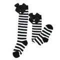 Detail view of black and white striped knee-high socks with large satin bows. - Kids (7-12 Years) / Thin Black White Striped / Black Bow