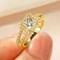 Luxuriöser goldfarbener Verlobungsring mit Zirkonia im Prinzessschliff für Damen, edel - Größe 5 / Prinzessschliff-Diamantring / Gold