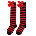 Close-up of girls' red and black striped over-the-knee socks with a large red satin bow - Kids (7-12 Years) / Thin Red and Black Stripes with Red Bow