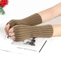 Close-up detail of brown knitted fingerless arm warmers for winter warmth and style. - One Size / Khaki
