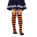 Close-up of orange and black striped Halloween socks with a cute plush pumpkin head - Kids (7-12 Years) / Orange & Black Stripes
