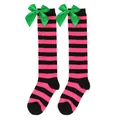 Close-up of pink and black striped knee-high socks with green satin bows for girls - Kids (7-12 Years) / Black/Rose Red Stripes with Green Bow