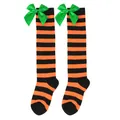 Festive girls orange and black striped over-the-knee socks with green satin bows - Kids (7-12 Years) / Orange and Black Stripes with Green Bow