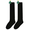Detailed view of black over-the-knee children's socks with a plush Christmas tree - 7-12 Years Old / Black (Christmas Tree)