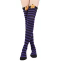 Macro view of Halloween purple and black striped over-the-knee socks featuring 3D pumpkin doll - One Size / Pumpkin Doll Decoration / Purple and Black Thin Striped