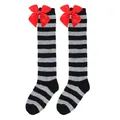 Detailed view of grey and black striped girls' knee-high socks with large red bows. - Kids (7-12 Years) / Grey and Black Stripes with Red Bow