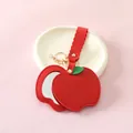 Red apple-shaped PU leather mirror keychain with elegant gold hardware and red strap - Apple Red