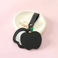 Sleek black apple-shaped PU leather mirror keychain with gold hardware and green leaf - Black Apple