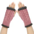Detail view of pink cable-knit fingerless gloves with grey faux fur trim on hands - One Size / Leather Purple