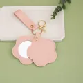 Flower-shaped pink PU leather keychain featuring a built-in compact mirror for bags - Pink