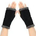 Detail view of black cable-knit fingerless gloves with grey plush faux fur trim - One Size / Black
