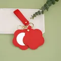 Elegant red flower-shaped PU leather keychain with integrated small round mirror accessory - Red