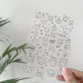 Transparent PVC sticker sheet with cute hand-drawn black line cartoon dog and bear patterns. - Q Puppy