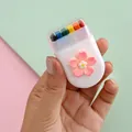Portable 6-color rainbow face paint sticks in white flower case for Halloween makeup. - Flower