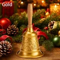 Close-up of golden metal hand bell featuring intricate ornate floral engraving details - Totem Style / Gold