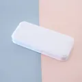 Minimalist white portable plastic pencil box for students shown in top view - Off White