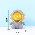 Creative astronaut night light and piggy bank in gray finish with warm internal LED glow - Sitting Style (Small) / 12cm x 10cm / Gray