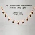 Ghirlanda natalizia 1,2m con 9 campane a pigna e luci LED calde per decorazioni festive - 1.2 Metri (9 Campane Con Luci LED)