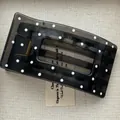 Close-up detail of a dark grey translucent polka dot hair claw clip on a neutral background - Rectangular Shape Duck Clip / Black White Polka Dot