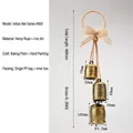 Vintage rustic antique brass cow bell hanging decor with burlap bow on natural jute rope. - #003 Indian Bell Series Gold Brush With Bow