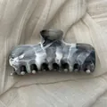 Detailed view of the elegant marble ink wash pattern on a large hair claw clip - L / Gray