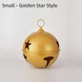 Small golden metallic Christmas bell ornament featuring star cutouts and a hanging ring - Star Style Small Gold