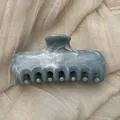 Close-up of elegant marble ink pattern blue hair claw clip on soft fabric background - L / Grey Blue