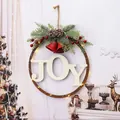 Festive JOY metal Christmas wreath with red bells and LED string lights for door decor. - JOY Sign