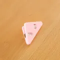 Pink triangular plastic corner clip for paper organization and document protection. - Pink
