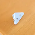 Light blue triangular plastic corner clip for paper organization and stationery use - Blue