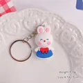 Cute white cartoon rabbit keychain pendant with blue dress and red bow - Rabbit / Blue