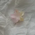 Close-up of small gradient plumeria flower hair claw clip on white textured background. - Smudged Frangipani Small / S