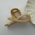 Detailed view of a large beige minimalist hair claw clip with a strong spring - Fishtail Style / 11cm / Twilight Yellow