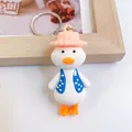 Cute cartoon duck keychain featuring a pink hat and blue polka-dot vest accessory - Cardigan Cute Duck