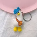 Cute cartoon tilted head duck keychain with blue hat and toast bread bag accessory - White Backpack Duck