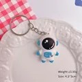 Schattige blauw-witte cartoon astronaut sleutelhanger hanger, afmeting 4,5 x 3 cm - Astronaut / Blauw