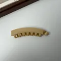 Klassieke beige bananenklem met stevige grip voor een paardenstaart - 10cm Grootte / Geel