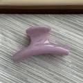 Close-up of small purple jelly hair claw clip with smooth curved design and glossy finish - Fruit Purple Pink