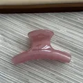 Detail of a pink jelly textured curved hair claw clip on a minimalist background. - Fruit Pink