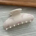Detailed macro view of a pastel hair claw clip with pink bow and polka dot patterns - Ingot Shape / L / Pink White