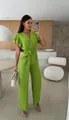 Detail of a chic lime green V-neck jumpsuit with short sleeves and a belted waist. - S / Top And Bottom / Green