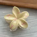 Detailed view of flower hair claw clip with pink ribbon pattern - Flower / M / Yellow