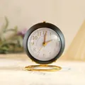 Minimalist mini round silent analog alarm clock in matte black and gold finish - Black