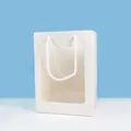 Detailed view of white paper gift bag featuring a large transparent display window and rope handles. - White Window Paper Tote Bag (Without Light)