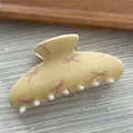 Macro detail of cream macaron hair claw clip featuring sweet pink bow ribbon prints. - Ingot Shape / L / Yellow